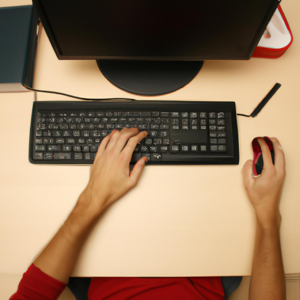 Person working at computer desk